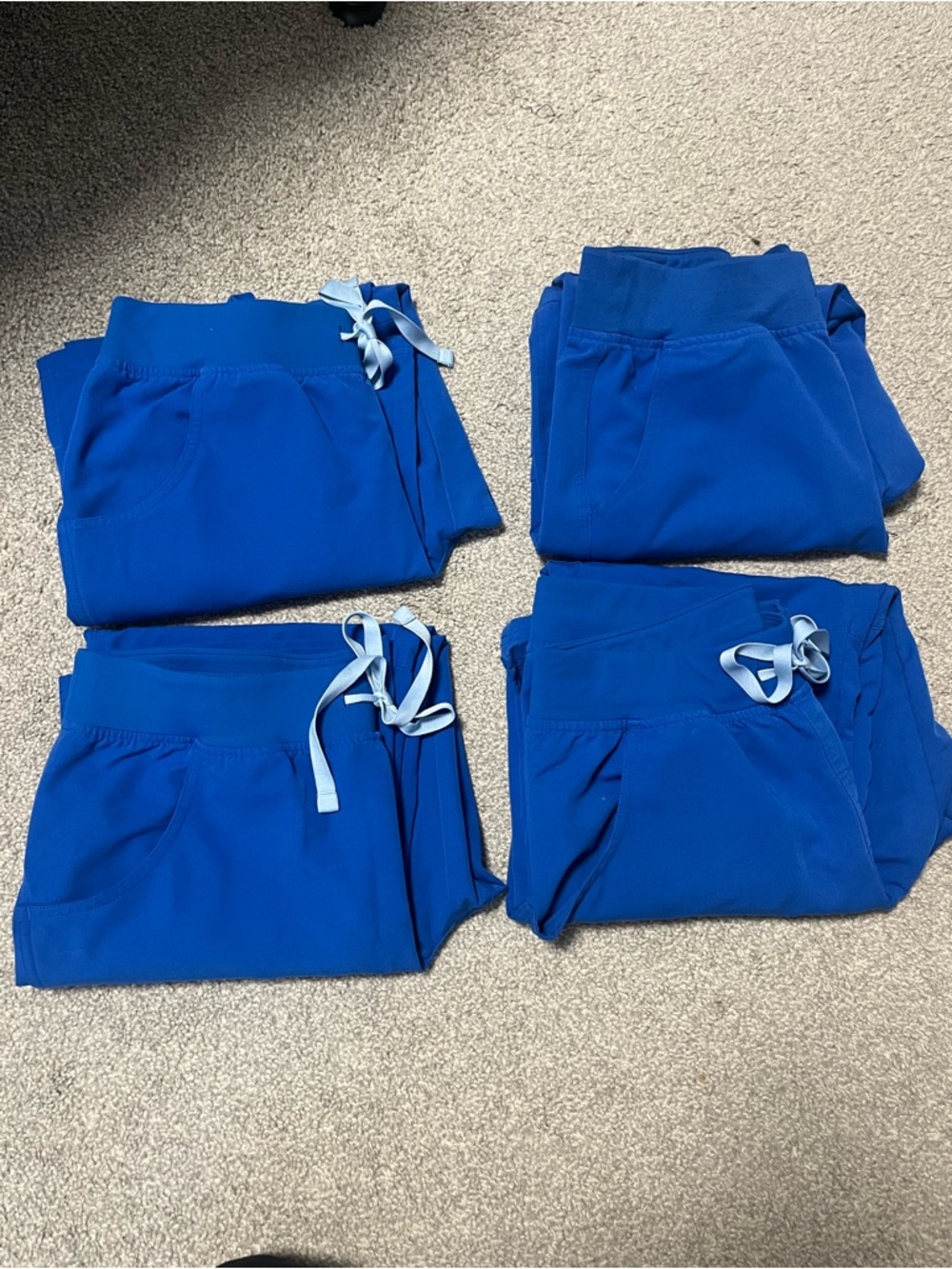4 Pairs of Figs, Kade Cargo Royal Blue Scrub Pants. 

All sized Medium Petite